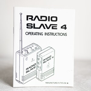 May include: Black and white line drawing of two Radio Slave 4 devices on a white background. The devices have a rectangular shape with a small antenna on the top. The text "RADIO SLAVE 4" is printed on the devices. The text "OPERATING INSTRUCTIONS" is printed at the top of the page. The text "MANUFACTURED IN THE USA" is printed at the bottom of the page.