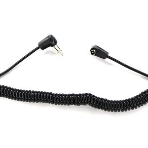 May include: Black coiled cable with a 2-pin plug at one end and a female connector at the other. The cable is designed to stretch and retract, and is likely used for connecting electronic devices.