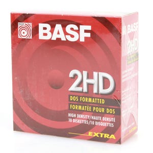 May include: A red and white box of BASF 2HD DOS formatted high-density diskettes. The box features the BASF logo and text in English and French, with "EXTRA" printed at the bottom.