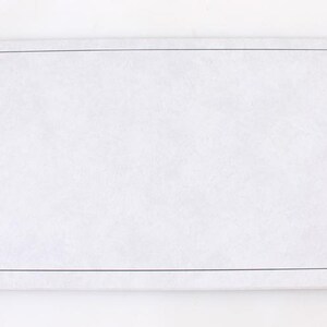 May include: A blank white card with a black border.