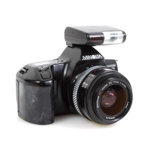 Minolta Maxxum 300i 35mm Film Camera with 35-70mm Lens & D 340i Flash Attachment