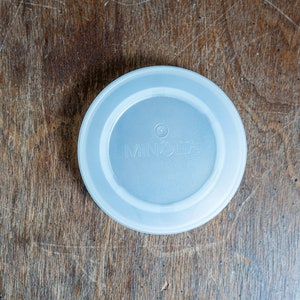 Minolta Maxxum Camera Body Cap White / Clear