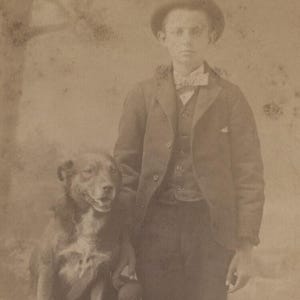Portrait Of Young Boy W/ Dog Posing On Stool W/ Painted Backdrop - Matted