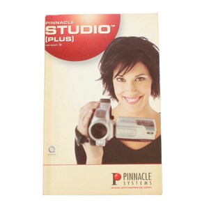 May include: A Pinnacle Studio Plus software box with a woman holding a camcorder. The box is white with red and black text. The text on the box reads "Pinnacle Studio (Plus) Version 9".