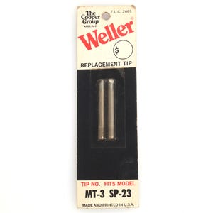 May include: A Weller replacement tip package. The package is white with red and black text. The package contains two silver-coloured replacement tips. The text on the package reads "REPLACEMENT TIP" and "TIP NO. FITS MODEL MT-3 SP-23".