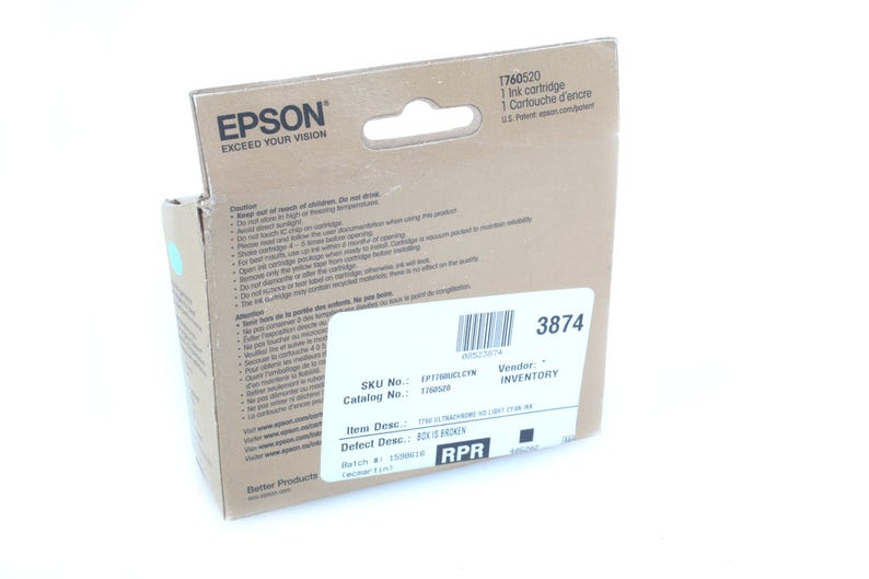 May include: A cardboard box of Epson ink cartridge. The box has the Epson logo and the text "EXCEED YOUR VISION". The label reads "1 Ink cartridge" and "1 Cartouche d'encre". The box also has a white label with a barcode and the number "3874".