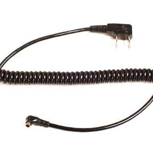 May include: A black coiled cable with a two-prong plug on one end and a right-angle connector on the other end.