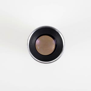 May include: A set of three ceramic mugs with a speckled, matte finish. The mugs are in shades of cream, light gray, and dark gray. Each mug has a simple, minimalist design, perfect for coffee or tea.