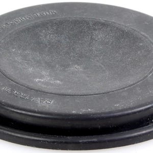 Op de afbeelding: Zwarte rubberen deksel met de tekst "PATERSON GORE-TEX System 4 mm Waterproof 14008" gedrukt op de onderkant.