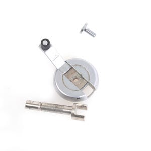 May include: A collection of silver mechanical components, including a circular piece, a lever, a cylindrical piece, and a screw, laid out on a white surface. The parts suggest a repair or replacement.