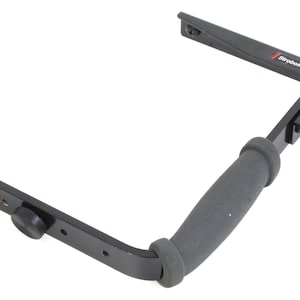May include: Black flash bracket with a padded handle and a swiveling arm. The bracket is labeled "Stroboframe".