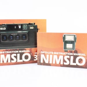 A Nikon F-301 camera body with instruction manual and book, together with various accessories, inclu