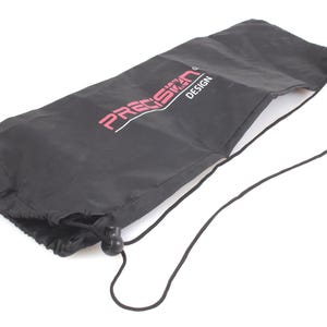 May include: Black drawstring bag with the text "PRECISION DESIGN" in pink. The bag is made of a smooth, possibly nylon, material. The drawstring is black and has a black plastic toggle. The bag is open at the top.