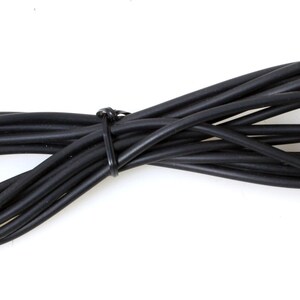 May include: A black coiled cable with two right-angle connectors at the ends.