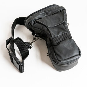 Vintage zwart gemonteerde spiegelreflex camera geval met riem