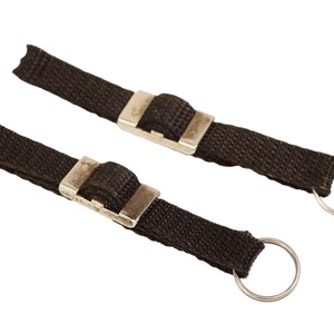 May include: Two black fabric keychains with silver metal clasps and key rings.