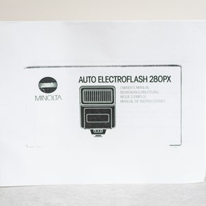 Puede incluir: Manual de instrucciones blanco para el flash Minolta Auto Electroflash 280PX. El manual incluye instrucciones en inglés, alemán, francés y español.