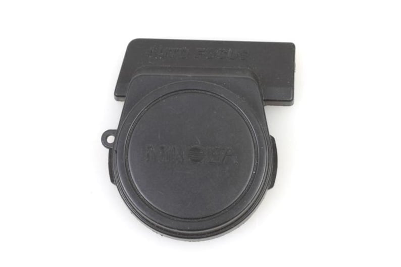 May include: Black camera lens cap with the text "AUTO FOCUS" and "TAMRON" printed on it.