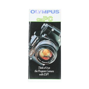 May include: A black Olympus OM-PC camera with a silver lens. The camera has a black strap and the text "Think of it as the Program Camera with ESP!" is printed on the bottom of the image.
