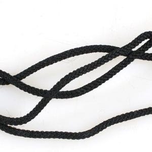 May include: A black lanyard with a plastic clasp. The lanyard is made of a thin, braided cord.