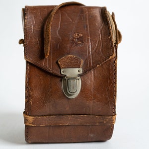 Fotocamera in pelle marrone vintage / custodia accessoria