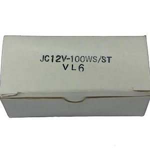 May include: A white cardboard box with the text "JC12V-100WS/ST VL6" printed on the top.