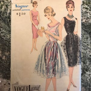 May include: Vintage Vogue sewing pattern number 4097 for a dress. The pattern is for sizes 12, 32, and 34. The pattern is illustrated with three women wearing different versions of the dress. The dress is a pinafore style with a scalloped edge.