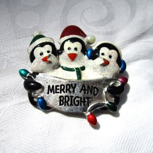 Vintage Christmas Penguins Brooch Snowy Merry And Bright String of Lights Penguins With Santa Hats Christmas Pin Penguin Carollers
