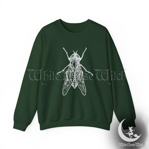 May include: A dark green sweatshirt with a white illustration of a fly on the front.
