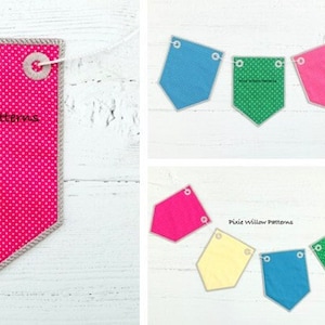 Könnte beinhalten: Ein rosa Stoffbanner mit weißen Punkten und einem weißen, gesteppten Rand. Das Banner hat oben zwei Ösen und der Text "Pixie Willow Patterns" ist in Schwarz auf der Vorderseite aufgedruckt.
