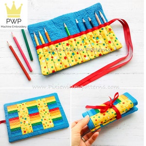 May include: A yellow and blue fabric pencil roll with red stars and a red ribbon. The roll is rolled up and tied with the ribbon. The roll is on a wooden surface.