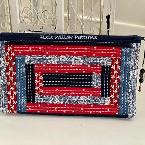 In the hoop Log Cabin Quilt Zipper bag pattern. Embroidery machine design of a zipper pouch with log cabin quilting and sashiko stitching