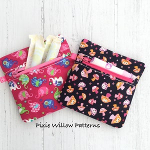 Bolsa con cremallera ITH. Bolsa con cremallera de toallas sanitarias. Bolsa con cremallera cuadrada de 6x6 totalmente forrada. En el proyecto The Hoop, diseño de máquinas de bordar ITH