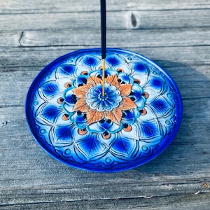 May include: A rustic wooden sign with the text "Welcome to our home" in white lettering. The sign features a distressed finish and a simple, inviting design, perfect for front door decor.