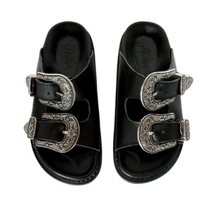 buckled leather slides
