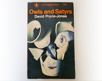 May include: A Penguin Books paperback cover with a dark background and a colourful abstract design. The title "Owls and Satyrs" is in orange text and the author "David Pryce-Jones" is in black text.