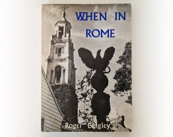 May include: A black and white photo of a book cover with the title "WHEN IN ROME" in blue text. The author's name, "Roger Langley", is printed below the title. The cover features a silhouette of a bird perched on a globe, with a church tower in the background.