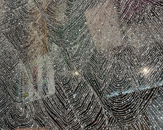 Beautiful silver on black french net tiny glass beads hand embroidered shinny glittery silver glass beads  54”wide. Best use for apparel