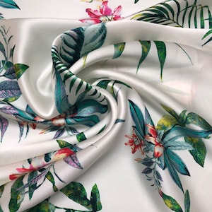 100% silk satin charmeuse digital print 54&quot; wide    Beautiful ivory base with multi color flower print silky soft fabric 54” wide