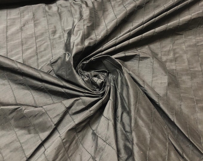 100% silk shantung pintuck, beautiful black color silk shantung pintuck. Best used for appreal and home decor. Sold by the yard