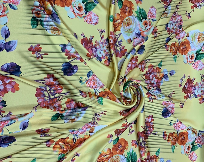 Designer digital printed Charmouse 54” wide.  Beautiful yellow base with colorful flowers print sold by the yard. Best use for apparel
