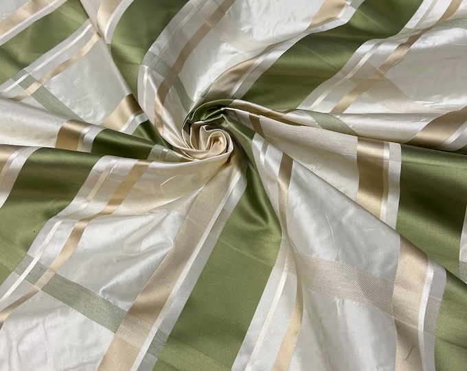 100% silk beautiful ivory base with olive sage green with ivory satin stripe plaids .  silk taffeta 54" wide            Sold by the yard
