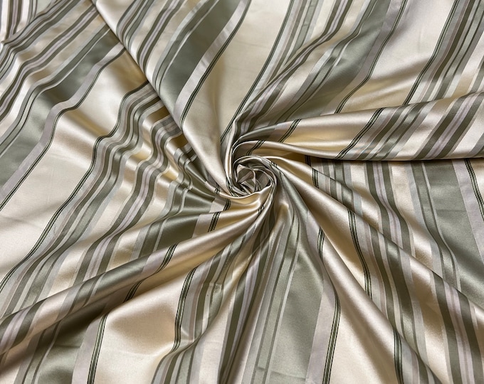 100% silk beautiful beige ivory cream with olive sage green shades  satin stripes.  silk satin taffeta 54" wide            Sold by the yard