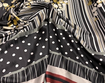 100% silk satin charmeuse digital print 54" wide    Beautiful black base with ivory wine stripe and polka dots floral design silk 54” wide