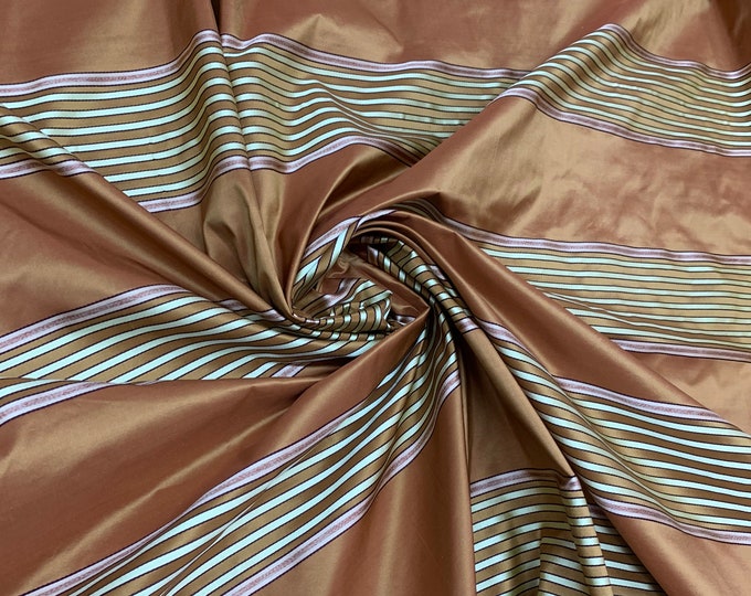 Beautiful burnt orange satin stripes 54” wide.  Best used for apparel & draperies. Sold by the yard.