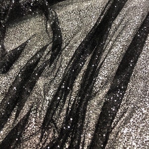 Black sequins on swirl meah fabric 52" wide   Fabric sold by the yard