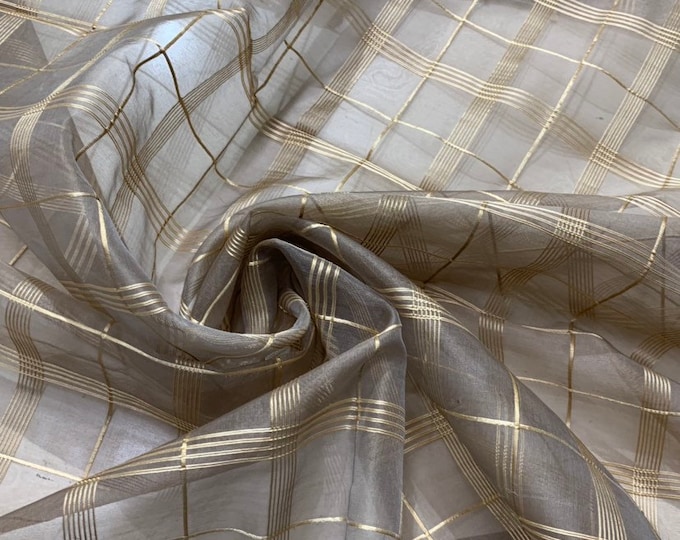 Silk organza check 45" wide   Beautiful tan color organza with gold checks sold by the yard    Best use for appreal & home decor
