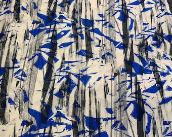 Mikado Zibelline printed fabric 54” wide.  Beautiful white base with black blue striped abstract print beat used for apparel.