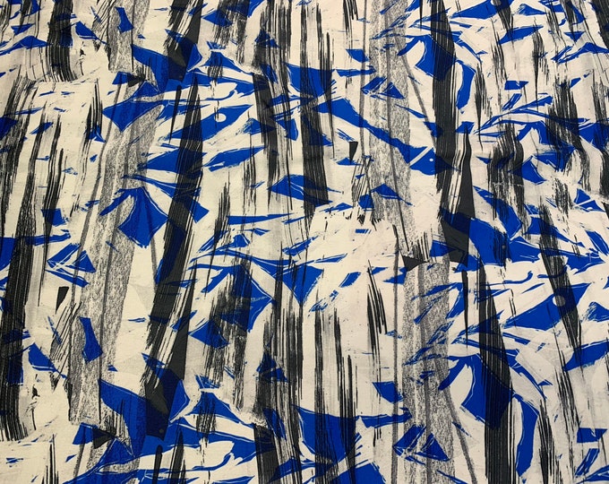Mikado Zibelline printed fabric 54” wide.  Beautiful white base with black blue striped abstract print beat used for apparel.