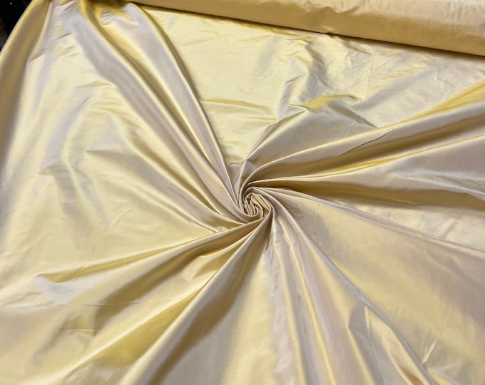 Beautiful bright Canary Yellow Irredescent 100% silk taffeta 54” wide.  Best used for apparel and home Decore.  Sold by the yard